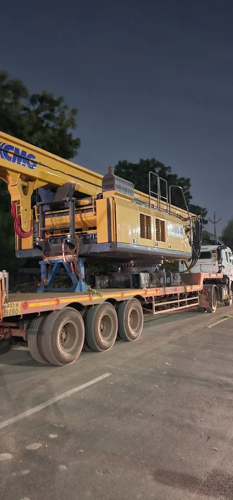 Tracked construction equipment loaded on a heavy equipment trailer