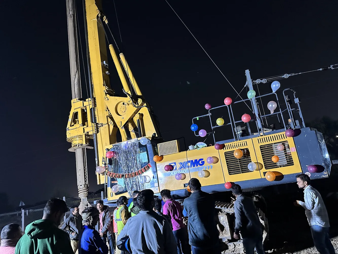 Night piling operation with lighting and field crew coordination