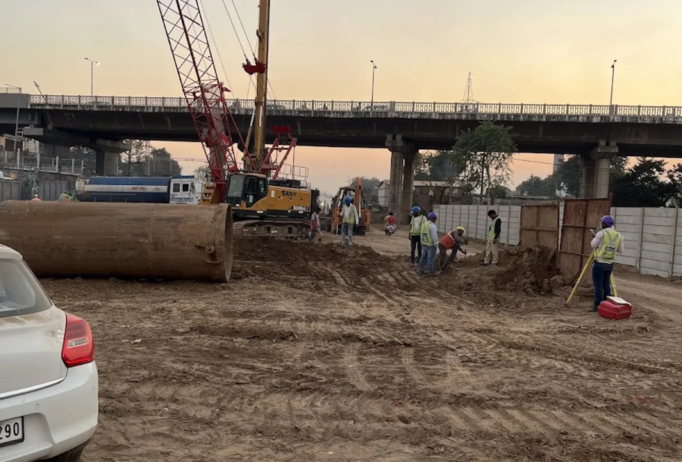 Foundation equipment and site team working near an infrastructure corridor
