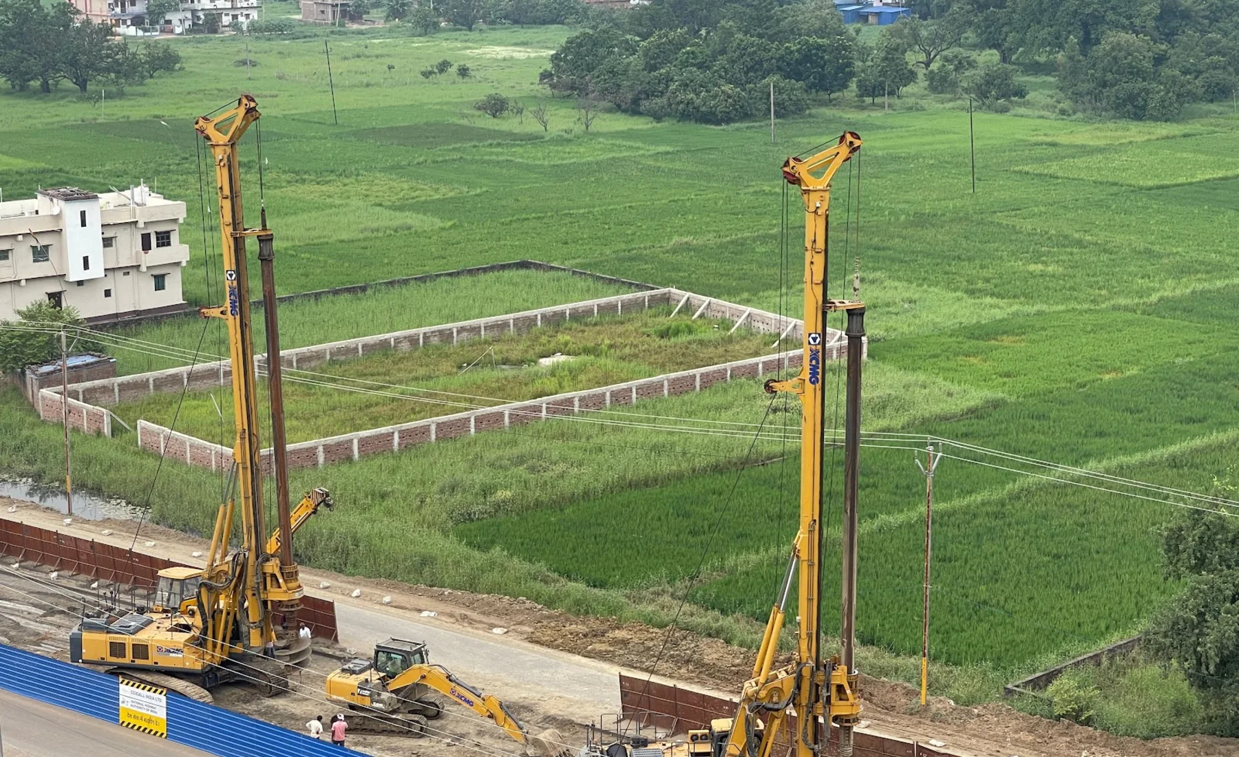Piling rigs operating near a field-side infrastructure site